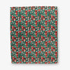 Christmas-themed patterned paper with red and green design on a white background