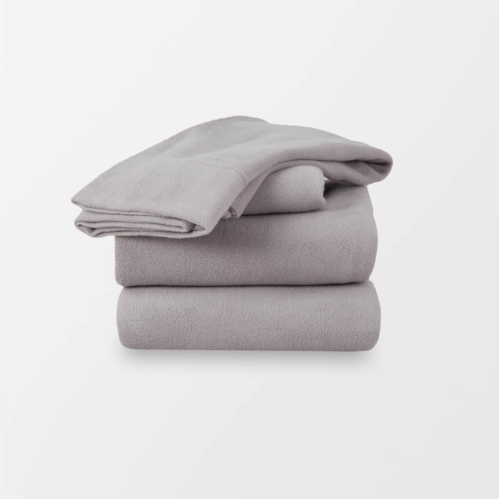 A stack of grey sheets neatly folded on a white background.