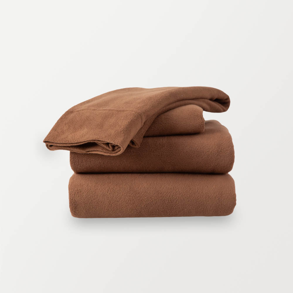 A stack of brown sheets neatly folded on a white background.