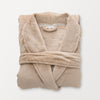 A tan VelvetLoft Luxury Plush Spa Robe folded neatly on a white surface.