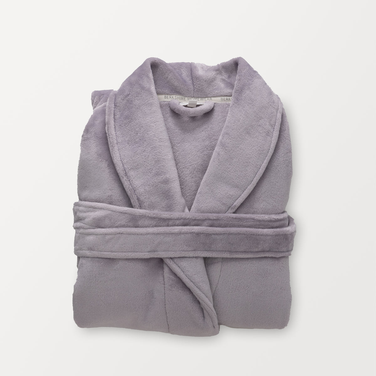 A purple VelvetLoft Luxury Plush Spa Robe folded neatly on a white surface.