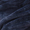 A close-up of the soft texture of a navy blue Extra-Fluffy Throw.