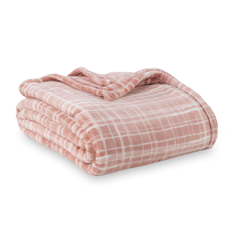 Peach colored plaid velvety plush bed blanket folded neatly on a white surface.