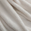 Close-up of the White Retro Comfort Plush Throw, highlighting its silky, textured fabric.