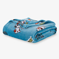 Folded blue blanket with cartoon character design on a white background