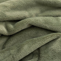 A close up of a green PrimaLush Cape Wrap, showing the texture of the fabric.