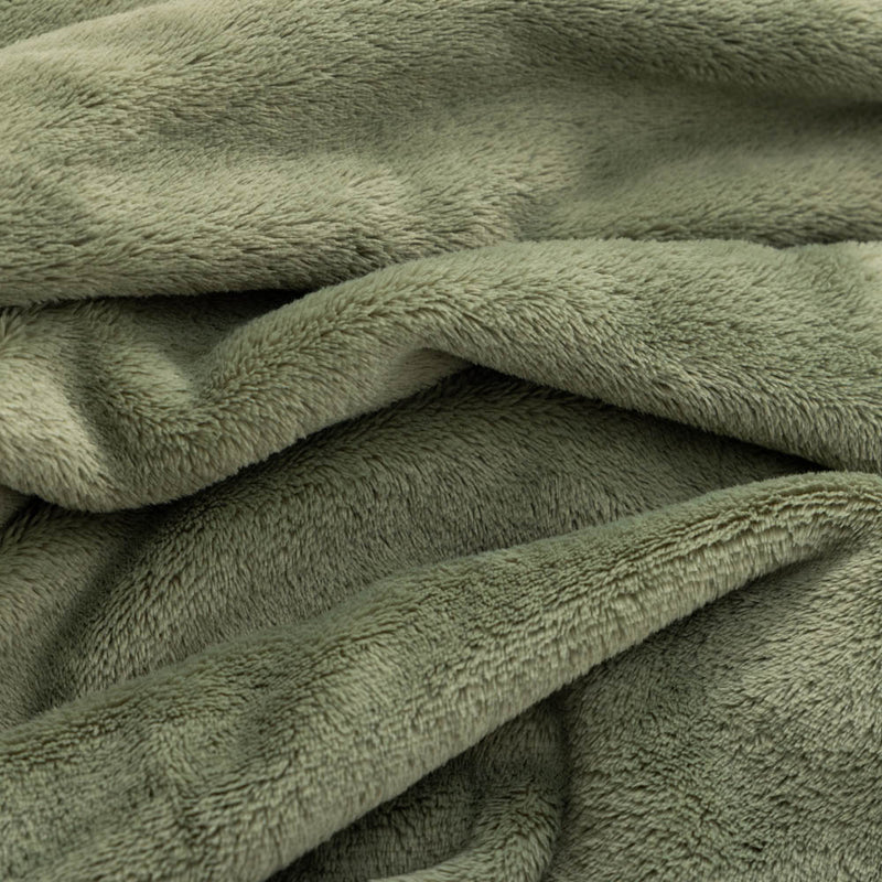 A close up of a green PrimaLush Cape Wrap, showing the texture of the fabric.