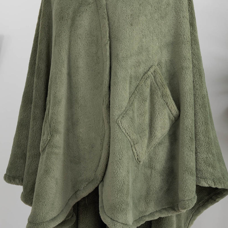 A close-up of the soft, velvety texture of an olive green PrimaLush Cape Wrap.