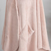 A close-up of the plush fabric of a blush pink PrimaLush Cape Wrap.