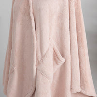 A close-up of the plush fabric of a blush pink PrimaLush Cape Wrap.