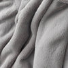 A close-up of the soft, plush texture of a gray PrimaLush Cape Wrap.