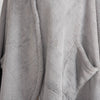 A close-up of the soft, plush texture of a gray PrimaLush Cape Wrap.