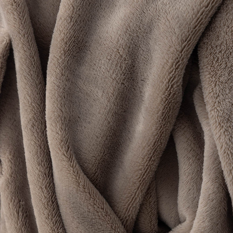 A close-up of the soft, fuzzy texture of a taupe PrimaLush Cape Wrap.