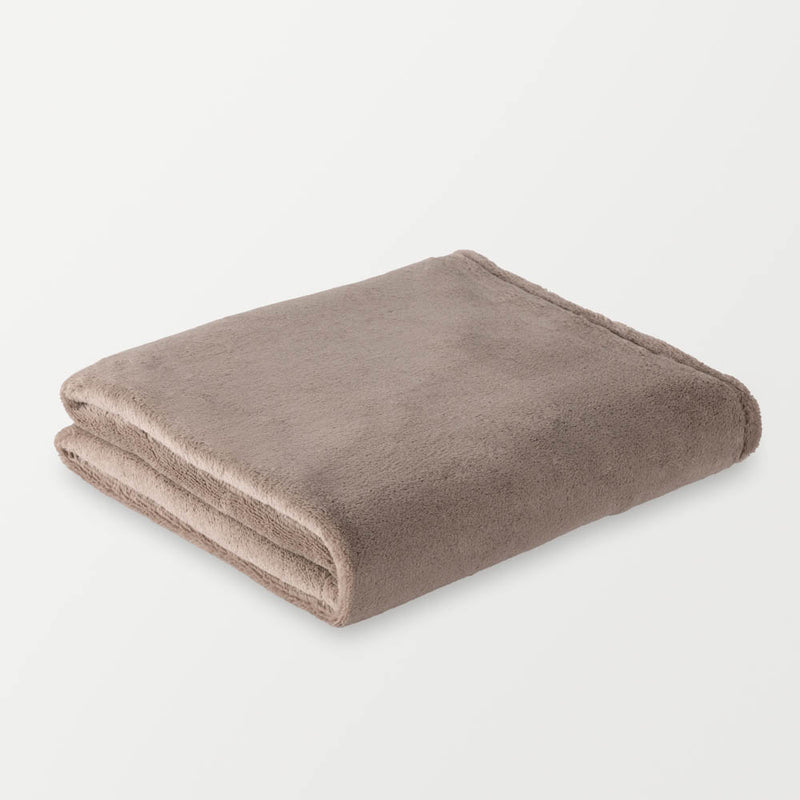 A folded taupe PrimaLush Cape Wrap on a white surface.