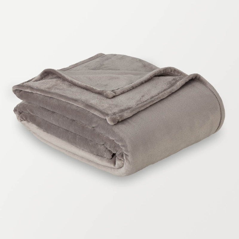 A folded gray velvet blanket displayed on a white surface.