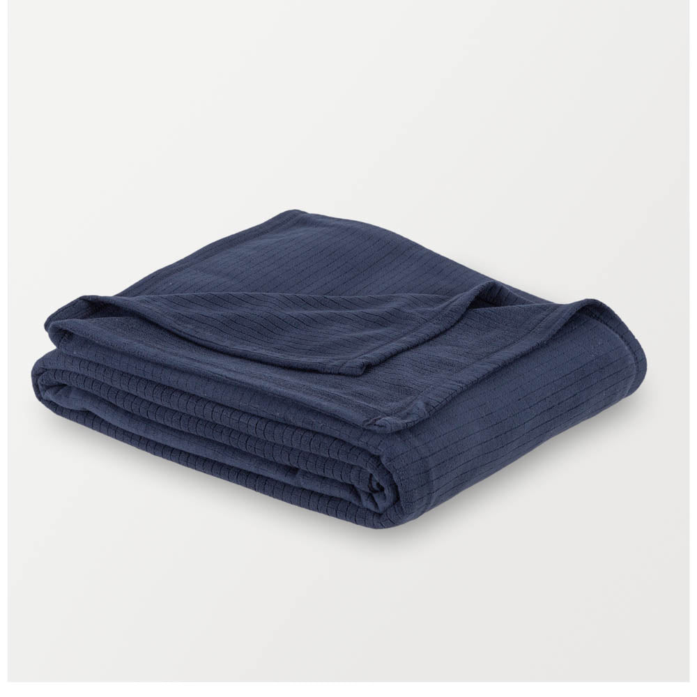 Folded navy Polartec Softec Microfleece blanket on a white background.