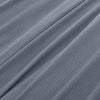 Close-up of the soft microfleece texture of the Polartec blanket in polar blue.