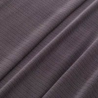 Close-up of the microfleece material of the blanket in dark gray, highlighting its soft texture.