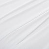 Close-up of the microfleece material of the blanket in white, highlighting its soft texture.