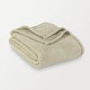 A close-up of a folded green Retro Comfort Plush Blanket on a white background.