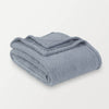 A folded blue Retro Comfort Plush Blanket on a white background.