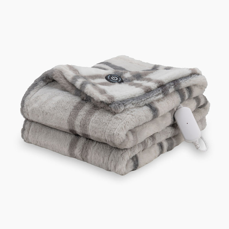 A neutral plaid heated Faux Fur Throw folded neatly on a white surface.