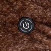 A close-up of a chocolate brown heated throw with a power button on its surface.