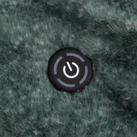 A close up of a dark green fur heated throw with a power button in the center.