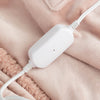 Close-up of the white power cord connected to the pink heated wearable throw.