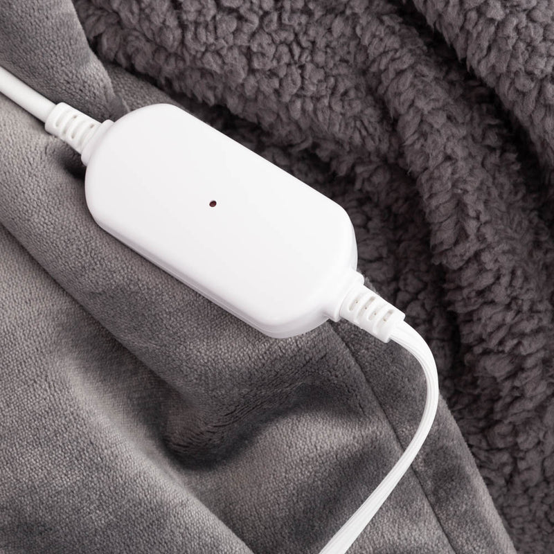 Close-up of the heated cord on the gray heated wearable throw.