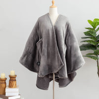 Gray heated wearable throw hanging on a white mannequin.