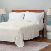 White pillowcases displayed ona bed in a bedroom setting.