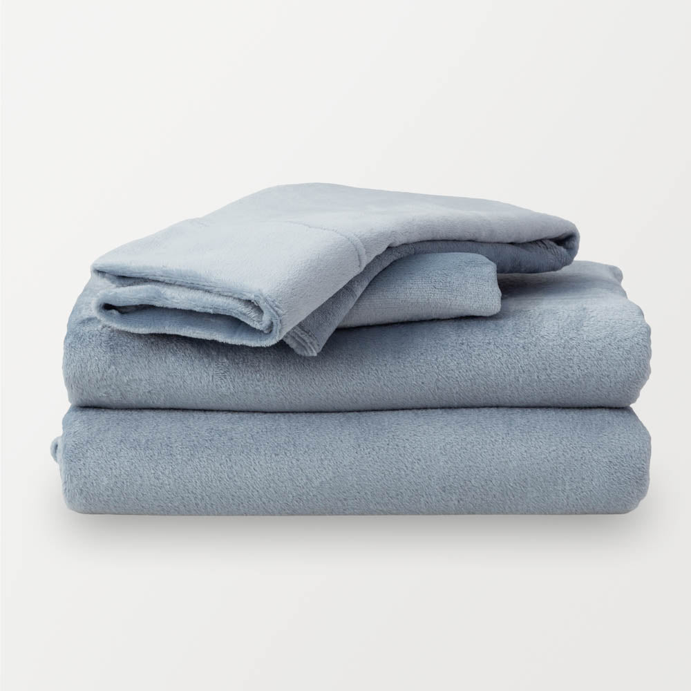 Folded Polar Blue (light blue)  sheet set on a white background.