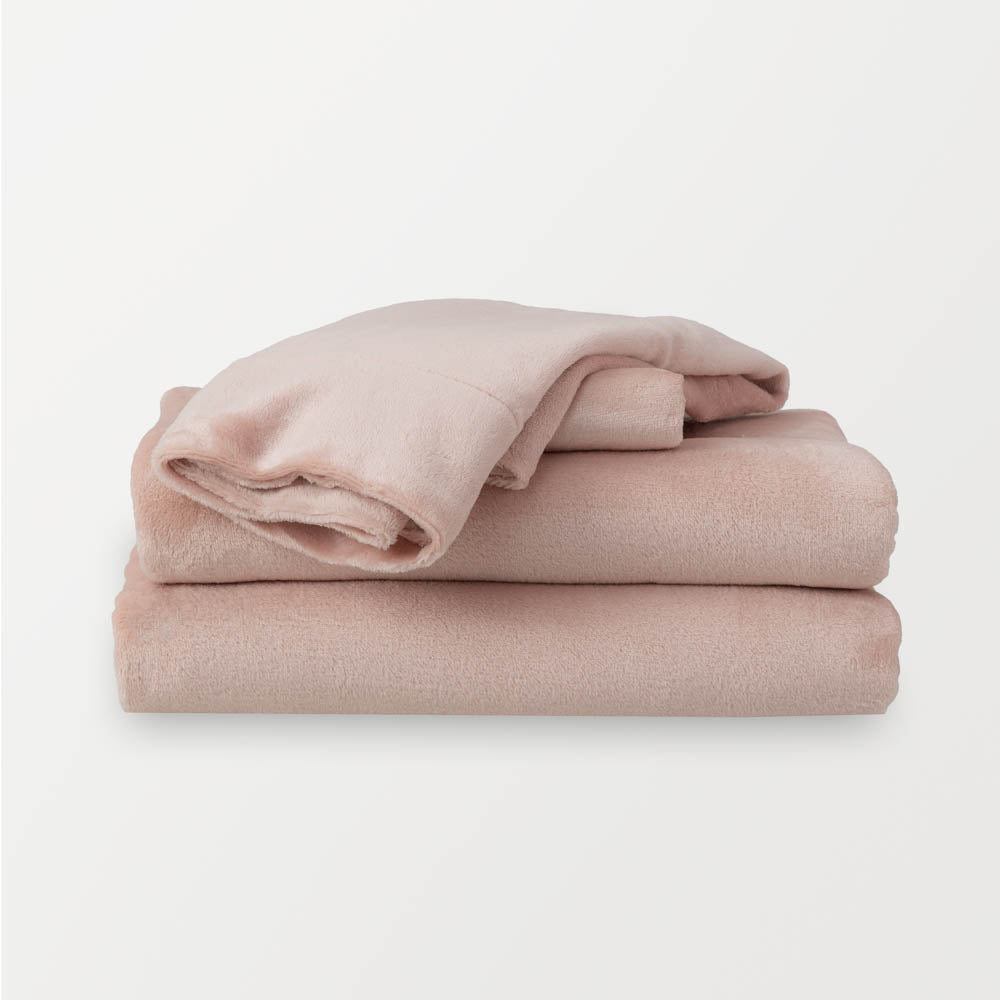 Folded rose smoke sheet set  (blush color) on a plain white background.