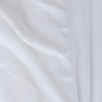 Close-up of white fabric with subtle texture
