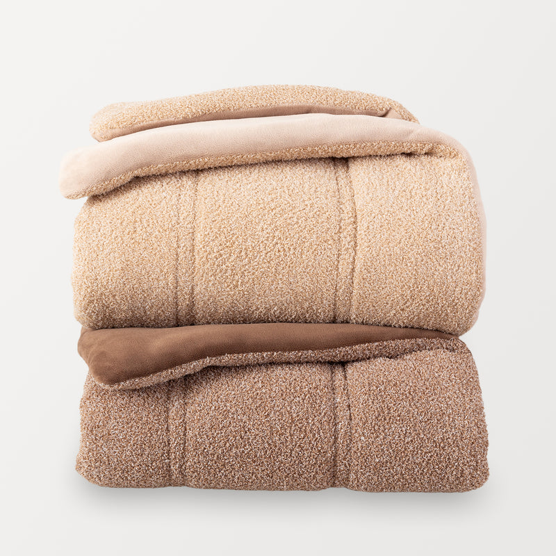 Two folded folded Retro Plush comforters stacked in a clean, organized display on white background. 