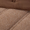 Close up shot to show the two reversible fabrications of the Retro Plush comforter set in Sumatra blend. 