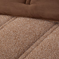 Close up shot to show the two reversible fabrications of the Retro Plush comforter set in Sumatra blend. 