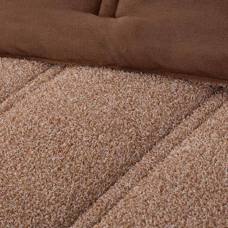 Close up shot to show the two reversible fabrications of the Retro Plush comforter set in Sumatra blend. 