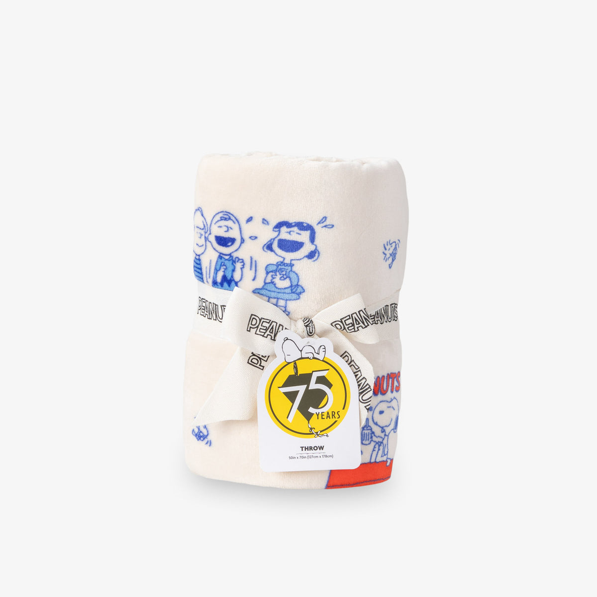 Printed Peanuts 75th Anniversary Throw rolled neatly on a white surface.