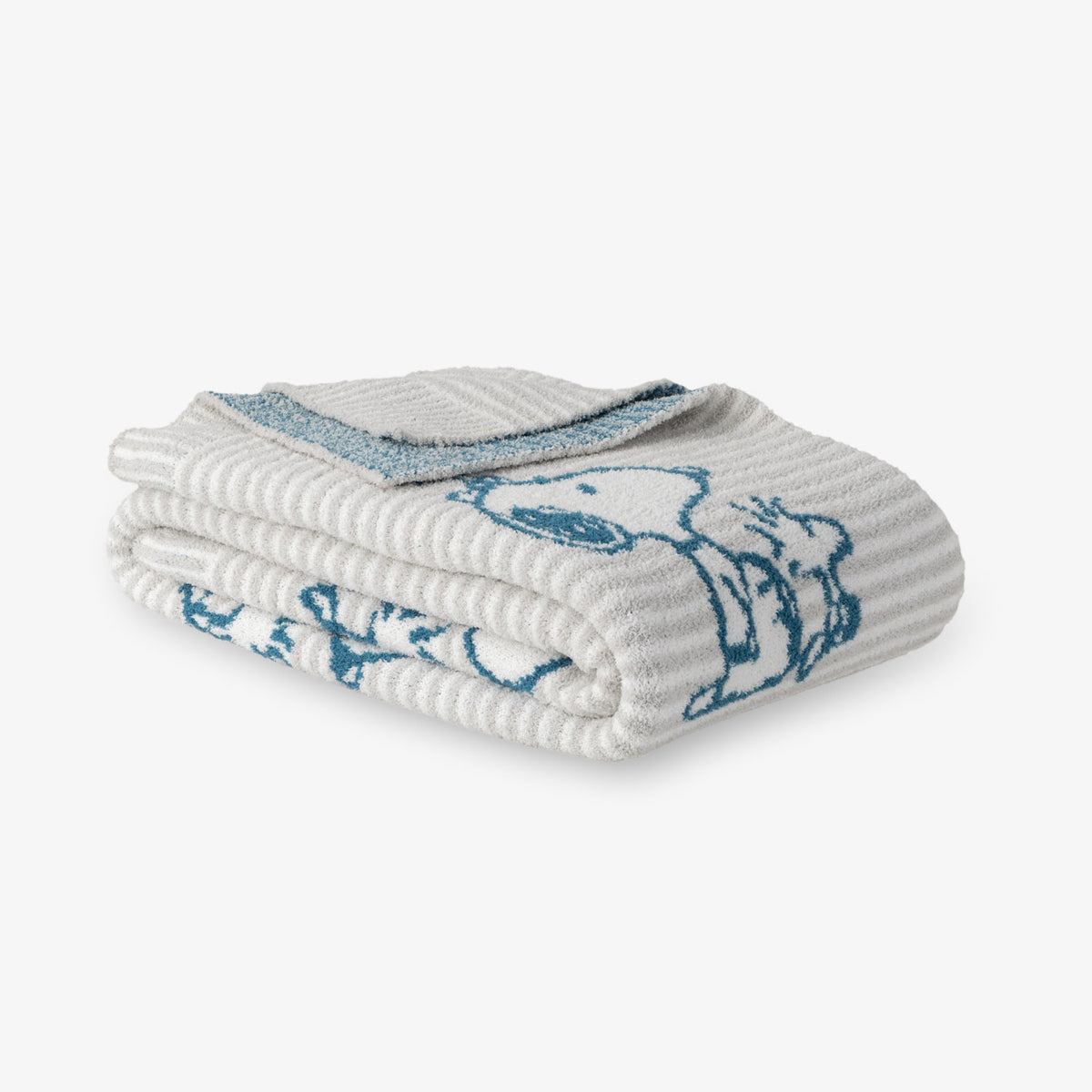 Peanuts striped MellowSoft Throw folded on a white surface.
