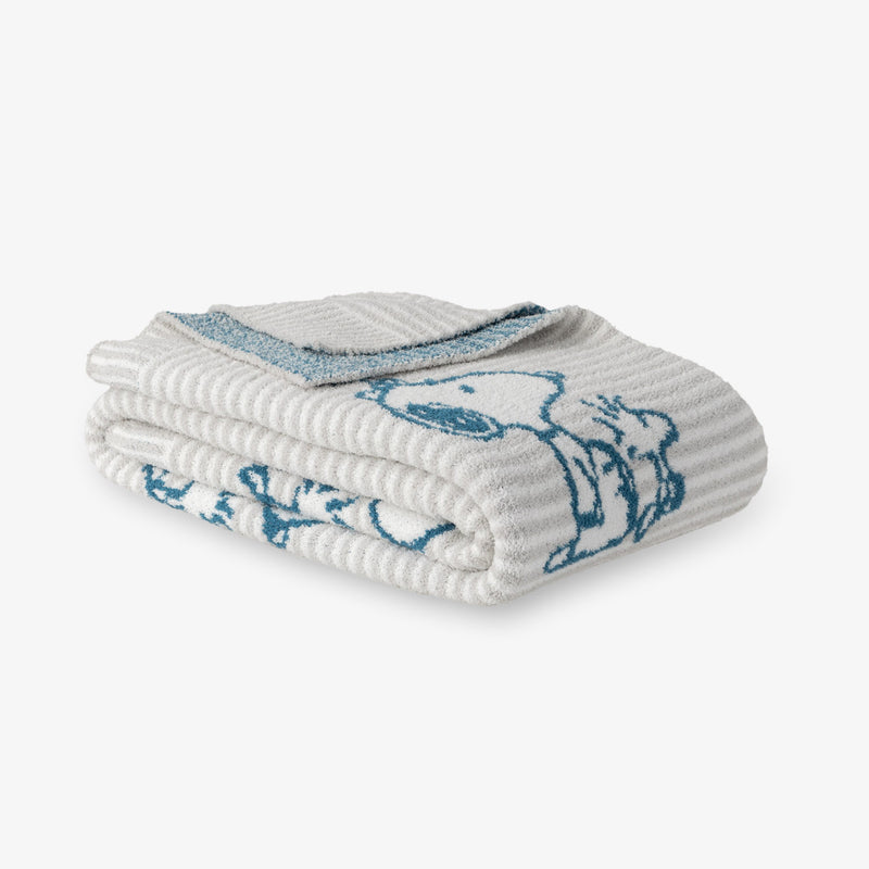Peanuts striped MellowSoft Throw folded on a white surface.
