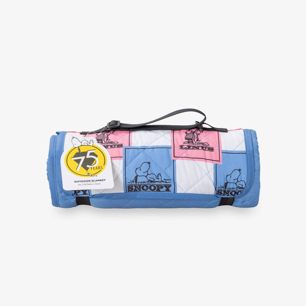 Peanuts 75th Anniversary packable outdoor blanket rolled neatly, sitting on a white surface.