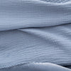 Close up of a blue VelvetLoft Gauze Throw.