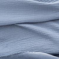 Close up of a blue VelvetLoft Gauze Throw.
