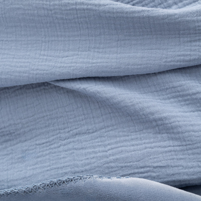 Close up of a blue VelvetLoft Gauze Throw.