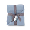 Blue VelvetLoft Gauze Throw folded neatly on a white surface.