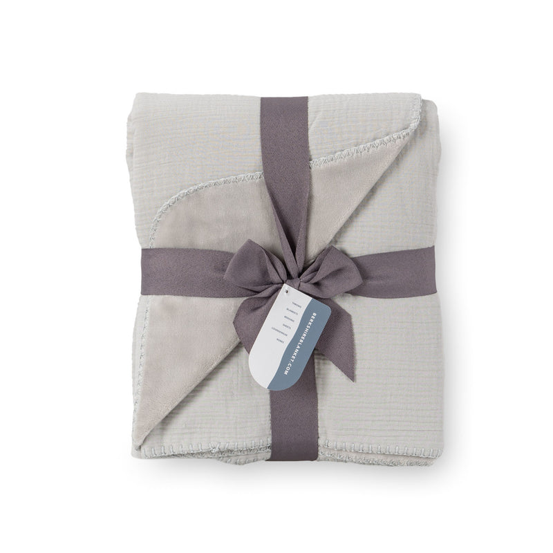 Grey VelvetLoft Gauze Throw folded neatly on a white surface.