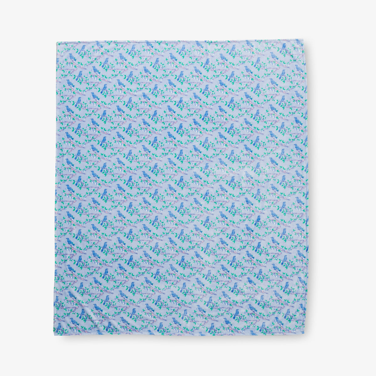 Krissy Mast Artist Series printed cherry blossom print throw laid flat on a white surface.