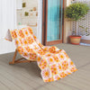 Vicky Yorke Summer Nostalgia beach draped neatly over a wooden lounge chair on a patio.
